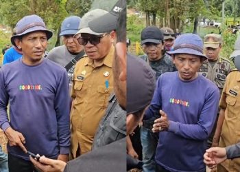 Sekretaris Daerah Luwu Timur, Ramadhan Pirade negosiasi dengan warga pada kegiatan pemasangan plang pengumuman di Dusun Laoli (Lampia), Desa Harapan, Malili, Sabtu (14/02/2026).