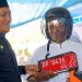 Bupati Luwu Timur, Irwan Bachri Syam, menyerahkan secara simbolis kendaraan dinas roda dua kepada petugas keagamaan pada peringatan Hari Jadi ke-14 Desa Wonorejo Timur, Kecamatan Mangkutana, Minggu (28/06/2026). Foto: Kominfo-SP